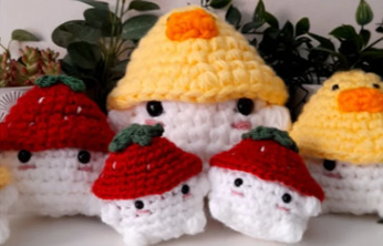 Crocheted mushroom friends in a row
